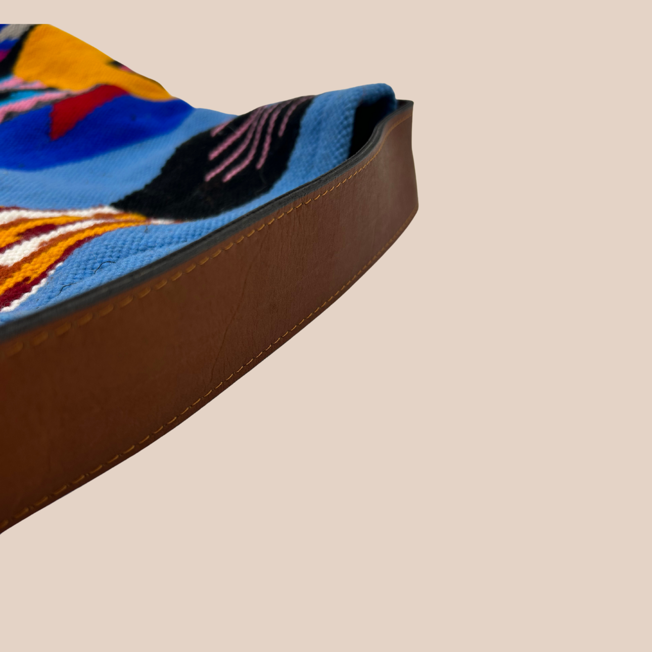 Handwoven South American wool tapestry bag with fish patterns.
Leather handle, navy blue velvet lining, and an interior pocket.
Magnetic closure.