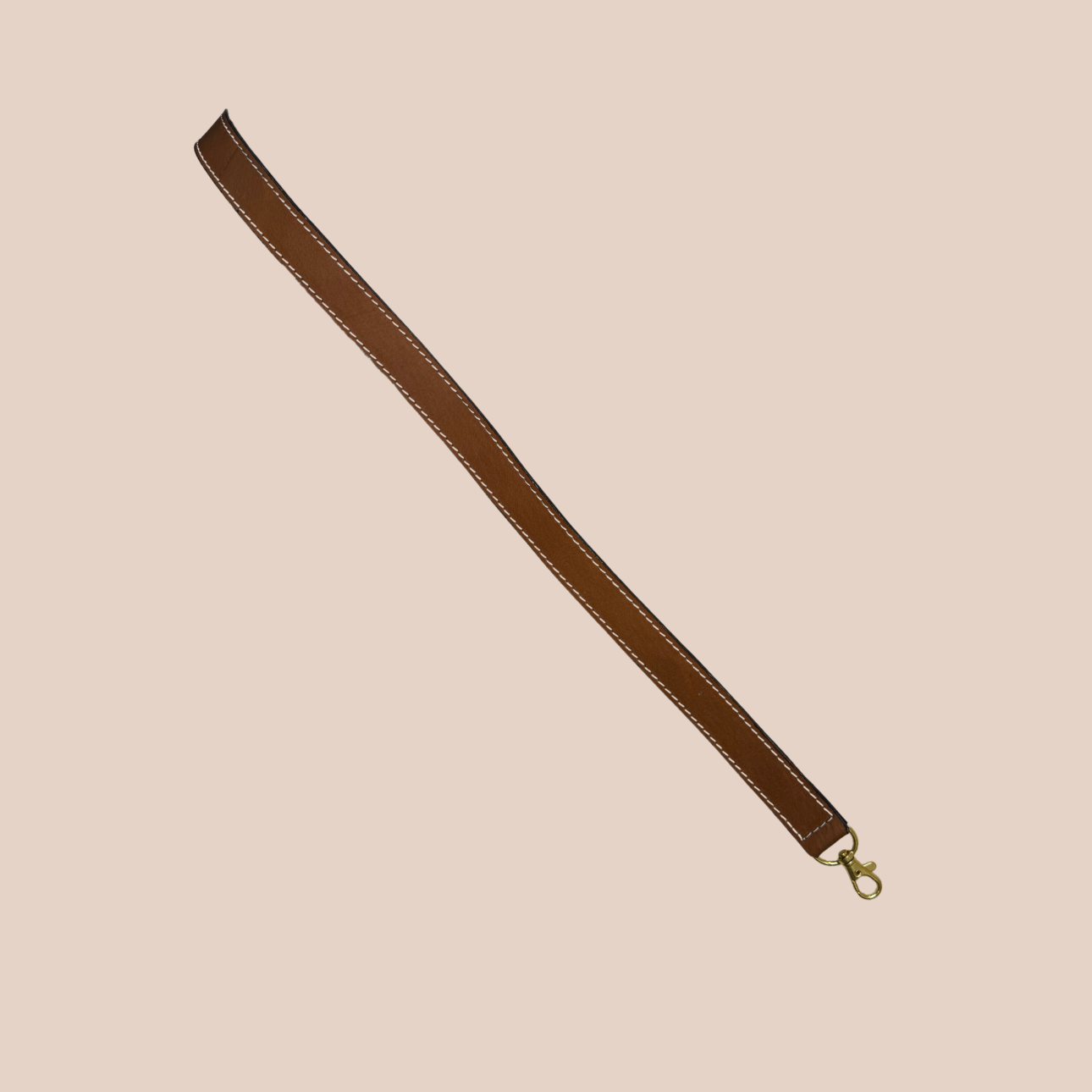 Image d'une bandouliere en cuir marron de Maison Badigo