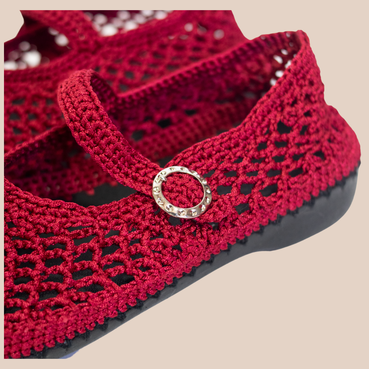 Red ballerina flats with a hand-crocheted waxed thread mesh design. Buckle closure and rubber sole.