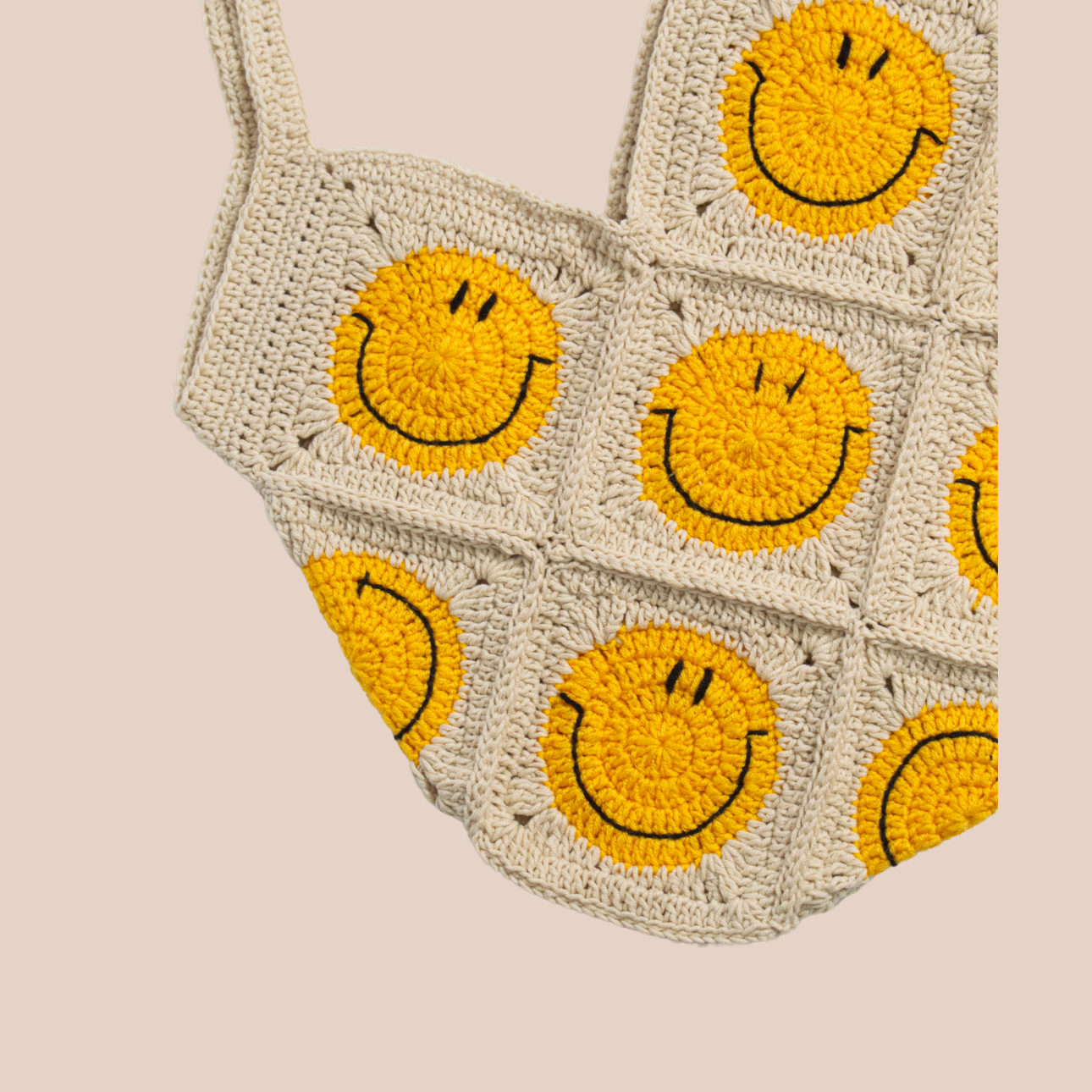 Hand-crocheted beige cotton bag.
Two large cotton handles and yellow smiley patterns.